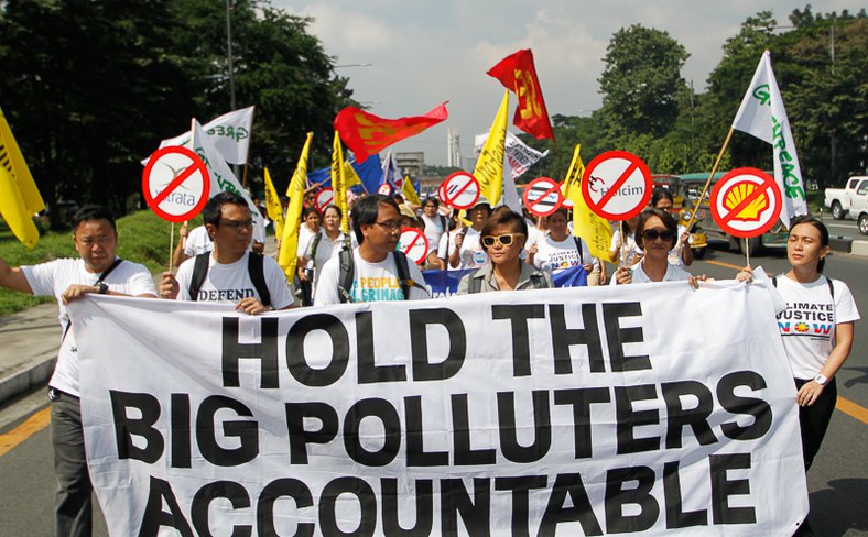 Typhoon survivors and civil society groups in the Philippines deliver complaint to the Commission on Human Rights of the Philippines (CHR) calling for an investigation into the responsibility of fossil fuel companies for climate change, 2015