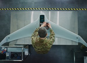 Military engineer works on drone